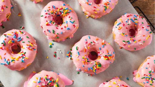 Homemade Sweet Donuts with Pink Frosting and Sprinkles