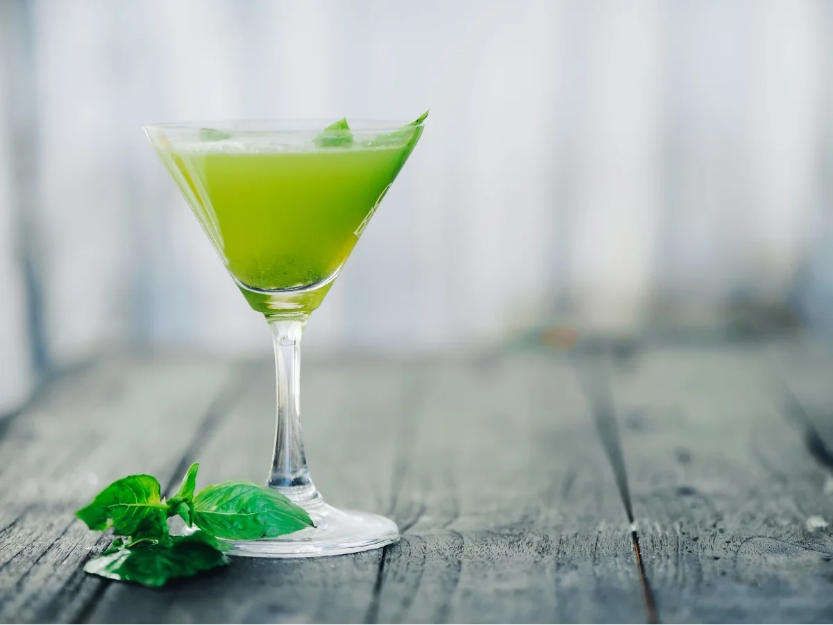 Green smoothie with mint and basil. Selective focus. Blurred foreground and background.