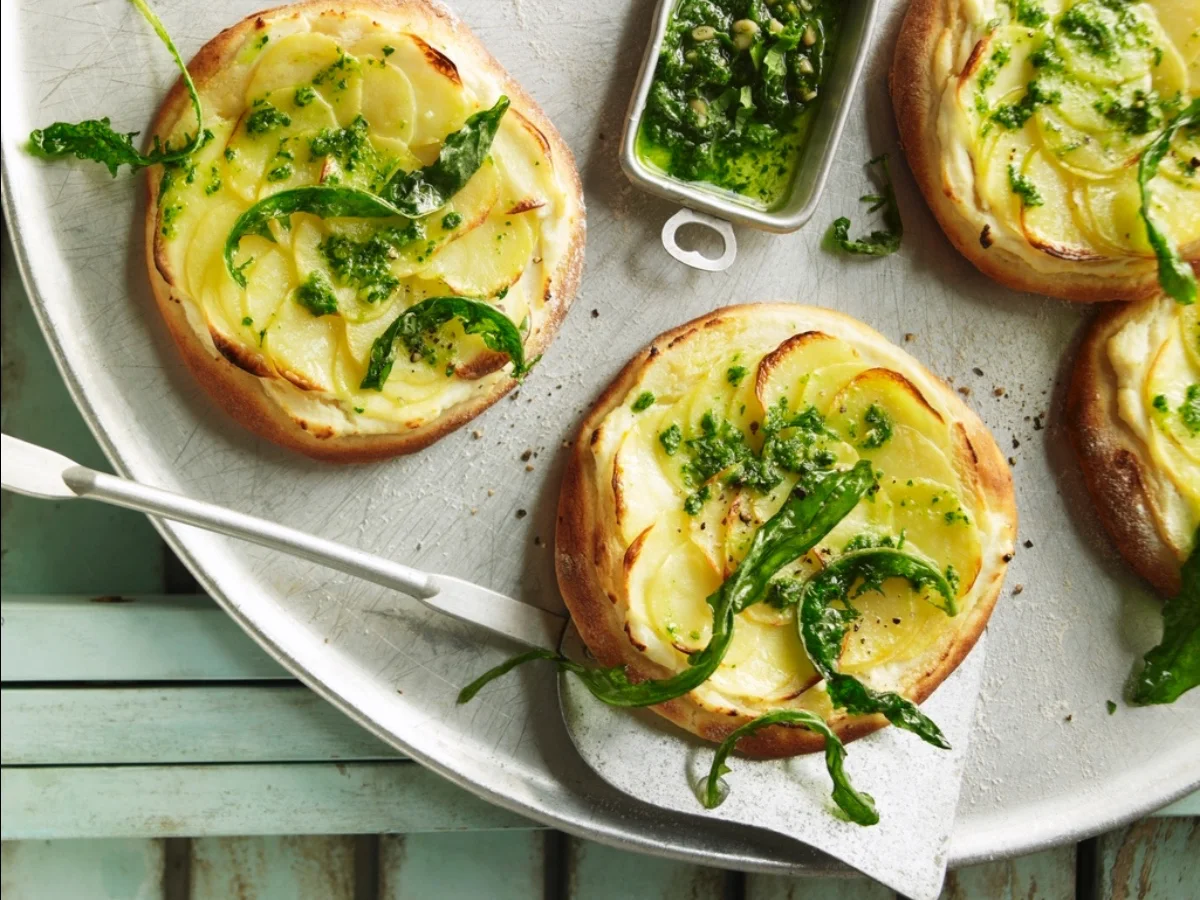 Mini potato pizzas with roasted dandelion pesto