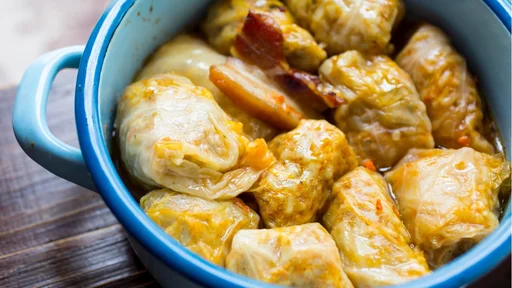Sarma, traditional Balkan and Eastern European holiday food - rolled up cabbage leaves stuffed with rice and minced meat (Sarma, traditional Balkan and Eastern European holiday food - rolled up cabbage leaves stuffed with rice and minced meat, ASCII