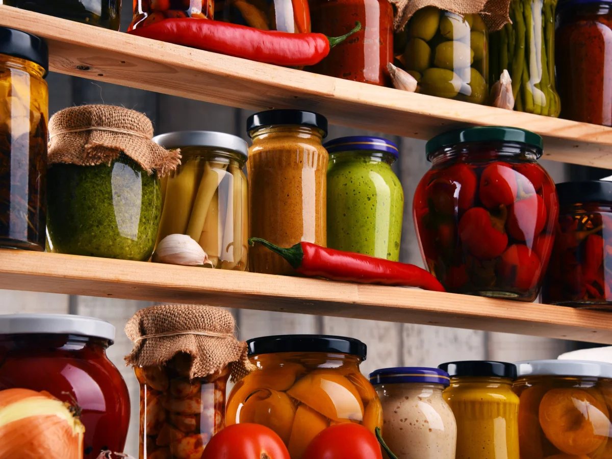 Jars with variety of pickled vegetables. Preserved food