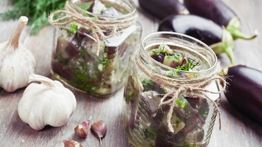 Marinated eggplant in jars on the table
