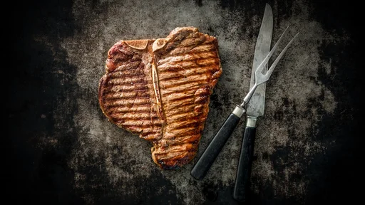 Grilled T-Bone Steak on dark background