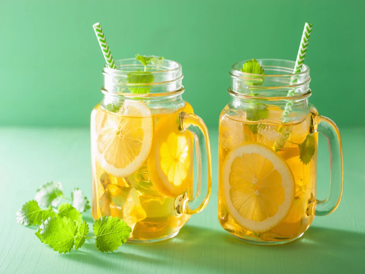 ice tea with lemon and melissa in mason jars