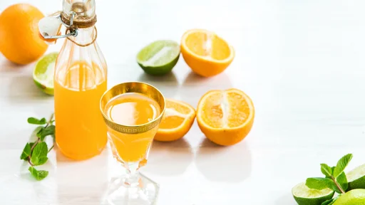 The glass of orange liqueur with mint. Selective focus