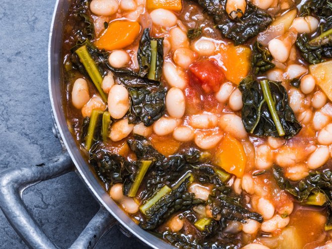 Soup with beans, kale, vegan food, directly above.